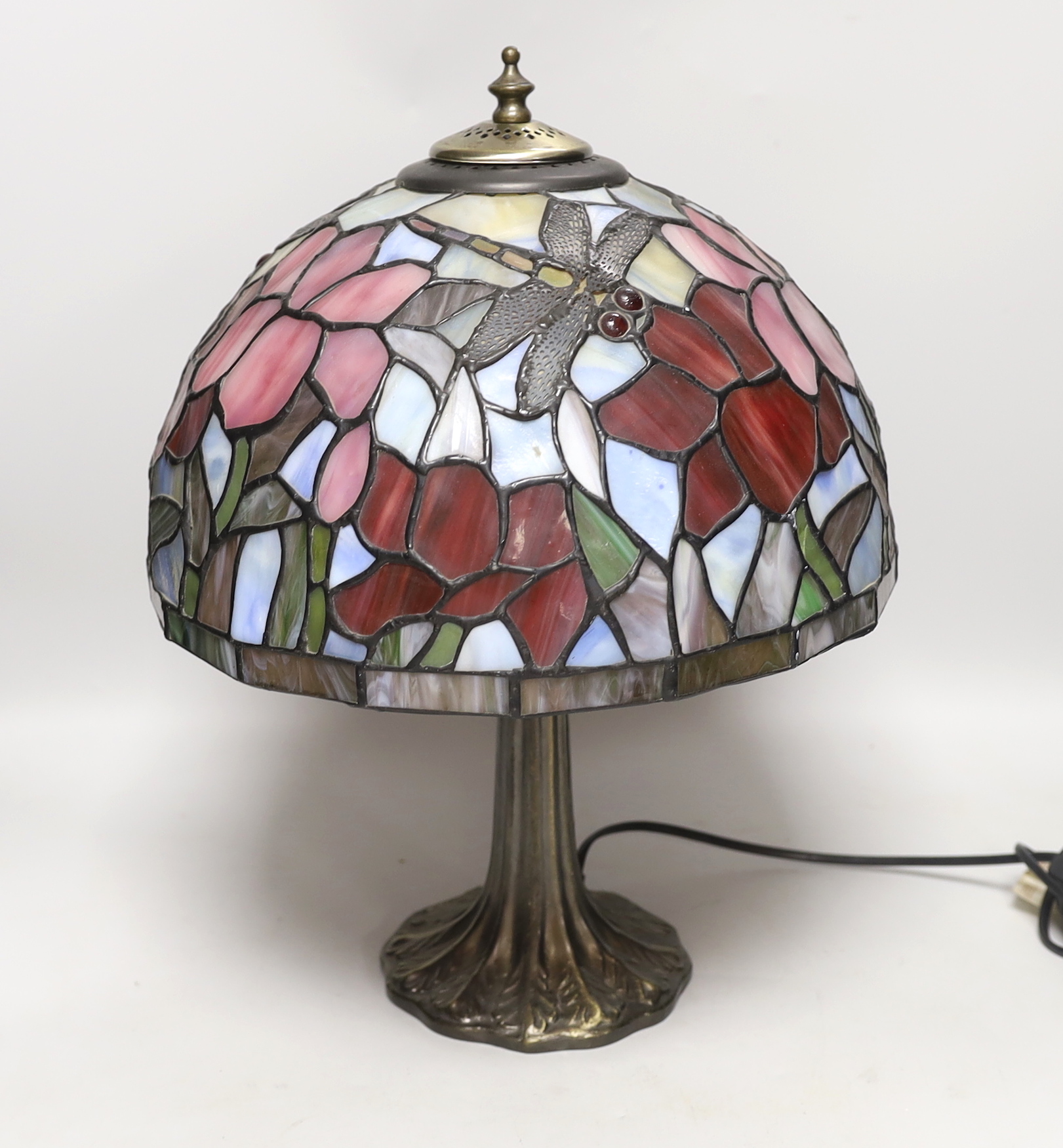 A reproduction Tiffany lamp, leaded glass shade with floral decoration and dragonflies, 40cm